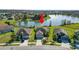 Aerial view of the property, showcasing its location and surrounding neighborhood near a lake at 2443 Torrens Dr, Lakeland, FL 33805