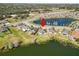 Aerial view of a home backing onto a lake in a residential neighborhood at 2443 Torrens Dr, Lakeland, FL 33805