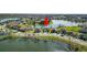 Scenic lakeside homes with lush green lawns, creating an inviting neighborhood atmosphere at 2443 Torrens Dr, Lakeland, FL 33805