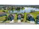 Waterfront homes featuring well-maintained lawns and mature landscaping in a quiet community at 2443 Torrens Dr, Lakeland, FL 33805