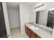 Bathroom with vanity, granite counters, and large mirror at 2443 Torrens Dr, Lakeland, FL 33805