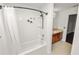Bathroom featuring a shower-tub combo and modern fixtures at 2443 Torrens Dr, Lakeland, FL 33805