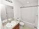 Bright bathroom with vanity, granite countertop, shower, and toilet at 2443 Torrens Dr, Lakeland, FL 33805