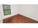Bedroom with wood-look floors and a window at 2443 Torrens Dr, Lakeland, FL 33805