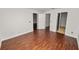 Neutral bedroom with wood-look floors and multiple doors at 2443 Torrens Dr, Lakeland, FL 33805