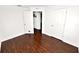 Bedroom featuring wood-look flooring and white walls at 2443 Torrens Dr, Lakeland, FL 33805