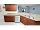 This open kitchen features granite countertops, stainless steel appliances, and ample counter space at 2443 Torrens Dr, Lakeland, FL 33805