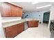 This open kitchen includes stainless appliances, granite counters, and cherry cabinets at 2443 Torrens Dr, Lakeland, FL 33805