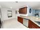 Bright kitchen features granite countertops, stainless steel appliances, and ample cabinet space at 2443 Torrens Dr, Lakeland, FL 33805