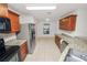 Bright kitchen features stainless steel appliances, granite countertops, and tiled flooring at 2443 Torrens Dr, Lakeland, FL 33805