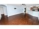 Open living space features wood laminate flooring and easy access to kitchen at 2443 Torrens Dr, Lakeland, FL 33805