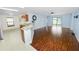 Open concept living room with laminated wood floors and access to the kitchen at 2443 Torrens Dr, Lakeland, FL 33805