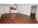 Spacious living room featuring modern wood floors, ceiling fan and an open layout to the kitchen at 2443 Torrens Dr, Lakeland, FL 33805
