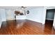 Open concept living room with laminated wood floors and adjacent to the kitchen at 2443 Torrens Dr, Lakeland, FL 33805