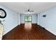 Open concept living room with laminated wood floors and direct access to the lanai at 2443 Torrens Dr, Lakeland, FL 33805