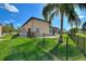 The fenced backyard offers a private outdoor space with a patio at 246 Laynewade Rd, Polk City, FL 33868