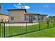 Fenced backyard with ample lawn space at 246 Laynewade Rd, Polk City, FL 33868
