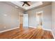 Large bedroom offers access to en suite bathroom and has hardwood floors at 246 Laynewade Rd, Polk City, FL 33868