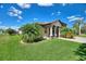 Beautifully landscaped front yard with palm trees adding tropical charm to this home at 246 Laynewade Rd, Polk City, FL 33868