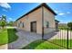 A paved walkway leads to the garage entrance, surrounded by a well-manicured lawn at 246 Laynewade Rd, Polk City, FL 33868