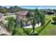 Back of the home featuring a wrought iron fence and a partial stone patio at 246 Laynewade Rd, Polk City, FL 33868