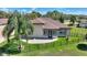 A nice yard features a stone patio and a wrought iron fence behind this well-maintained home at 246 Laynewade Rd, Polk City, FL 33868