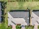 A nice roof on a home with well kept landscaping and two cars in the driveway at 2820 Attwater Loop, Winter Haven, FL 33884