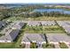 Overhead view of the community featuring well-maintained lawns and scenic surroundings at 2820 Attwater Loop, Winter Haven, FL 33884