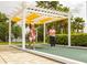 Outdoor bocce ball court with pergola offers a fun and social recreation area for residents and their guests at 2820 Attwater Loop, Winter Haven, FL 33884