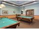 A game room with two pool tables ready for a game at 2820 Attwater Loop, Winter Haven, FL 33884