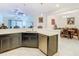 Kitchen featuring stainless steel appliances, white countertops, and a view to the living and dining areas at 2820 Attwater Loop, Winter Haven, FL 33884