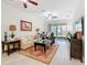 Bright living room with ceiling fans, neutral decor, and sliding glass doors to the outside at 2820 Attwater Loop, Winter Haven, FL 33884