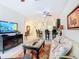 Open concept living room with adjacent kitchen, dining area, and comfortable seating at 2820 Attwater Loop, Winter Haven, FL 33884