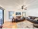 Inviting living room featuring hardwood floors, recessed lighting, neutral walls, and a cozy seating arrangement at 3025 Canandaigua Trl, Lakeland, FL 33810