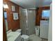 Bathroom featuring a shower and washing machine at 3030 Sun Way, Lakeland, FL 33801