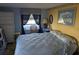 Serene bedroom with a queen-size bed, decorative wall art, and soft lighting at 3030 Sun Way, Lakeland, FL 33801