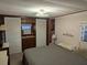 Comfortable bedroom with a full-size bed and a neutral color scheme at 3030 Sun Way, Lakeland, FL 33801