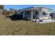 Well-maintained home featuring a large front yard with beautiful landscaping at 3030 Sun Way, Lakeland, FL 33801