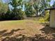 Large fenced backyard with mature trees at 309 Lake Dale Dr, Auburndale, FL 33823