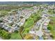 Aerial view of a golf course community featuring well-maintained greens and single Gathering homes at 3158 Pebble Bend Dr, Lakeland, FL 33810