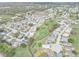 Overhead view of a neighborhood featuring a golf course running through the middle, surrounded by homes at 3158 Pebble Bend Dr, Lakeland, FL 33810