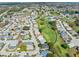 Aerial view of a well-maintained golf course community with single-Gathering homes surrounding the greens at 3158 Pebble Bend Dr, Lakeland, FL 33810