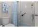Bright bathroom featuring a glass shower, updated fixtures, and nautical themed decorations at 3158 Pebble Bend Dr, Lakeland, FL 33810