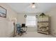 Bedroom with a desk, chair, unique armoire, ceiling fan and natural light at 3158 Pebble Bend Dr, Lakeland, FL 33810