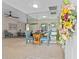 Bright dining area featuring mirrored wall, round table with blue chairs and a flower arrangement at 3158 Pebble Bend Dr, Lakeland, FL 33810