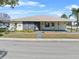 Charming single-story home featuring a covered entrance, well-maintained landscaping, and sunny curb appeal at 3158 Pebble Bend Dr, Lakeland, FL 33810