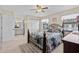 Inviting main bedroom featuring a ceiling fan, closet, and an ensuite bathroom at 3158 Pebble Bend Dr, Lakeland, FL 33810