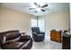 Comfortable bedroom featuring two recliners, a dresser, and neutral decor at 3510 Kenwood Xing, Lakeland, FL 33812