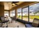 This sunroom features an outdoor view, ceiling fan, and comfortable seating at 3510 Kenwood Xing, Lakeland, FL 33812