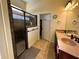 Bathroom featuring a walk-in shower with glass doors and a double sink vanity at 394 Nolane Ln, Polk City, FL 33868